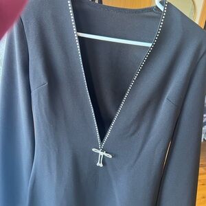 Black Dress with Rhinestone Trim and Bow Brooch